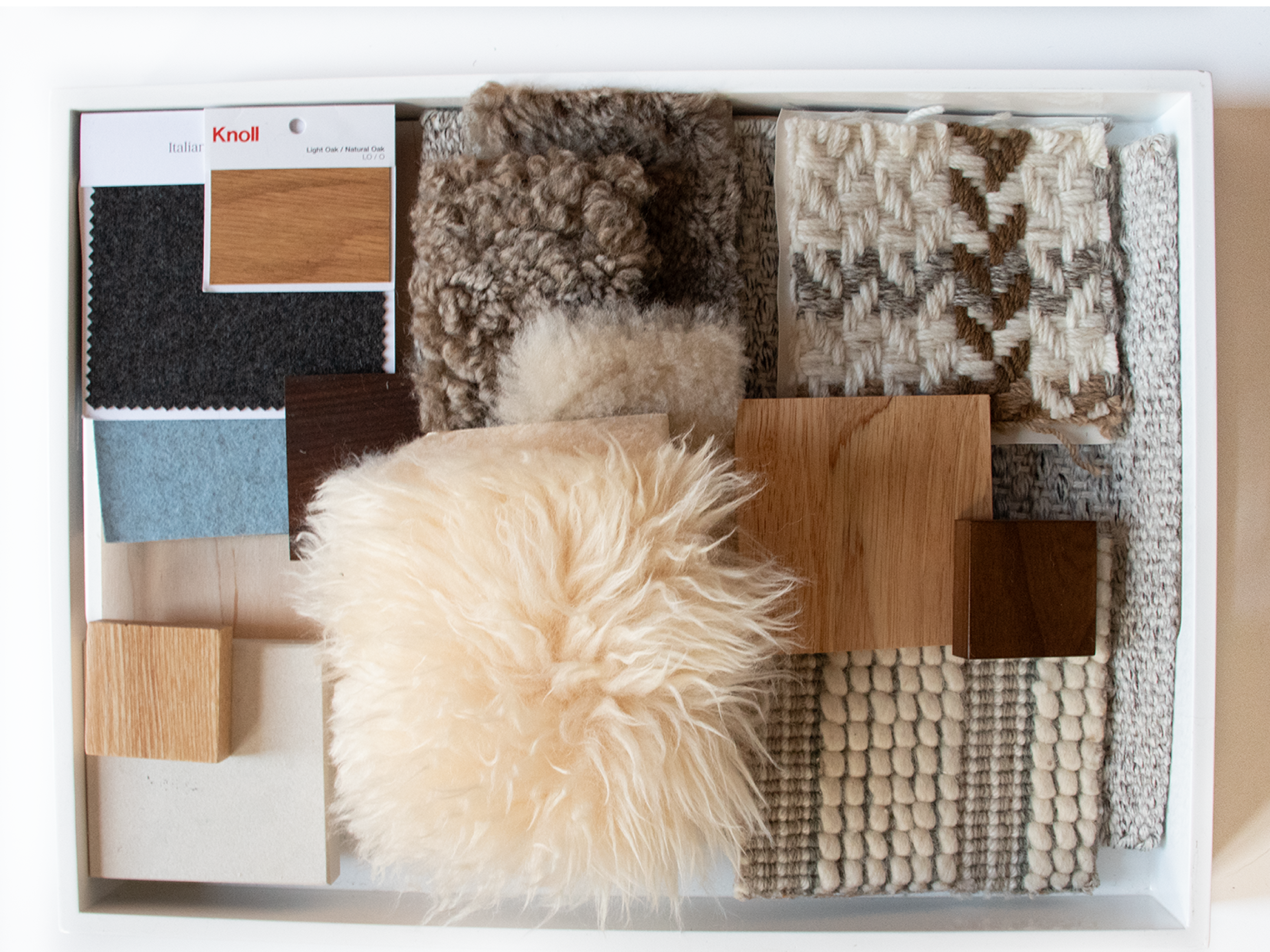 Interior material palette with wood samples, textiles, and natural textures