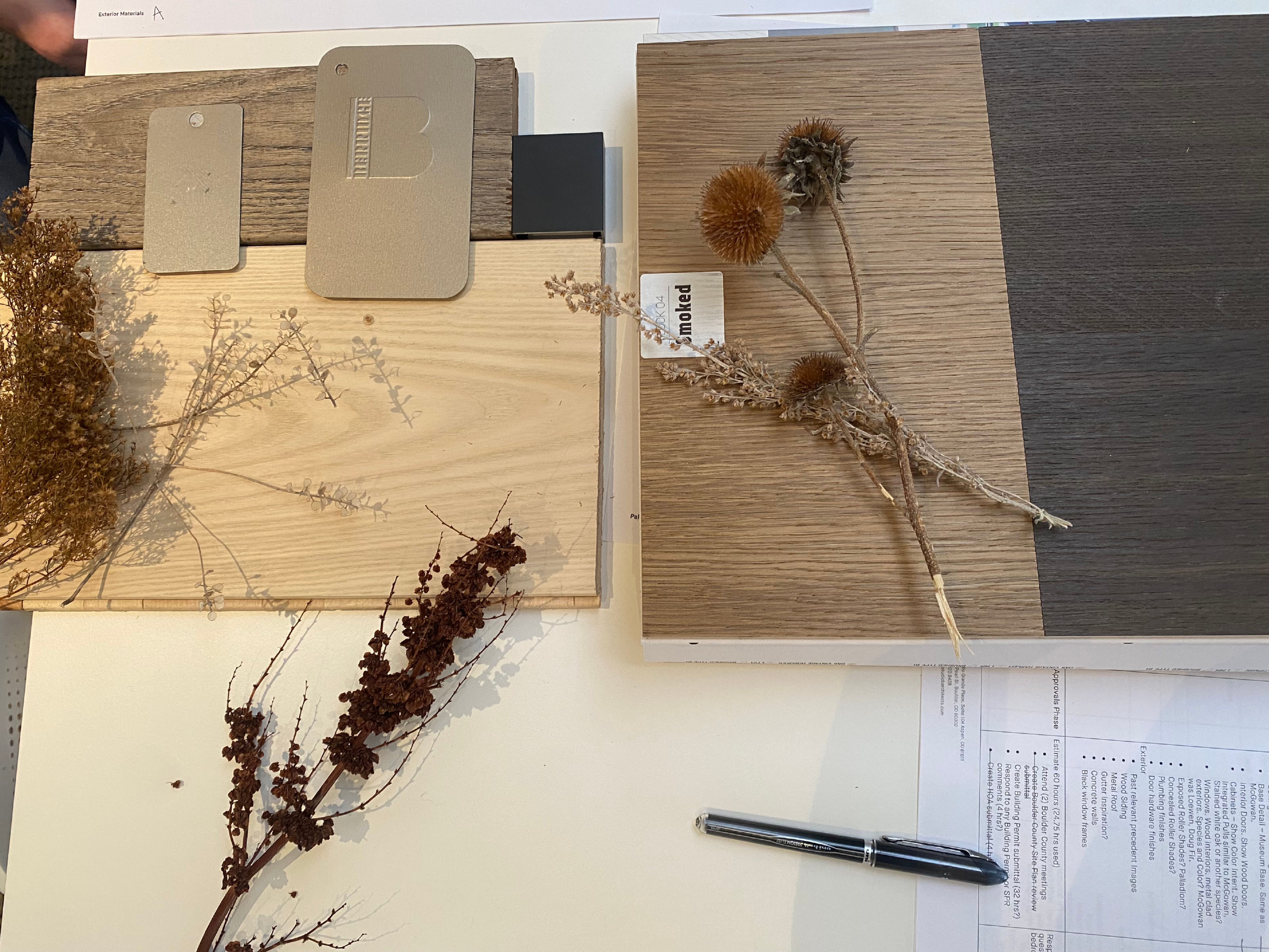 Wood material samples and natural elements curated for a modern residential project